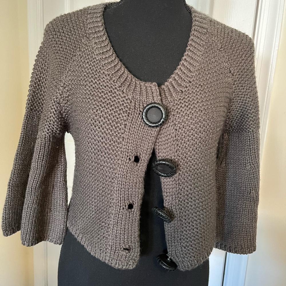 Designer knit sweater with leather embroidered buttons
